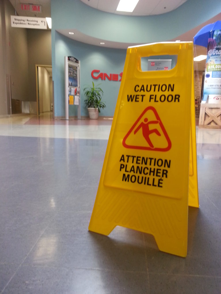 A caution: wet floor sign to prevent slip and fall accidents