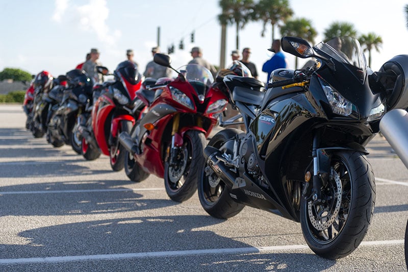 Line of motorcycles in a parking lot