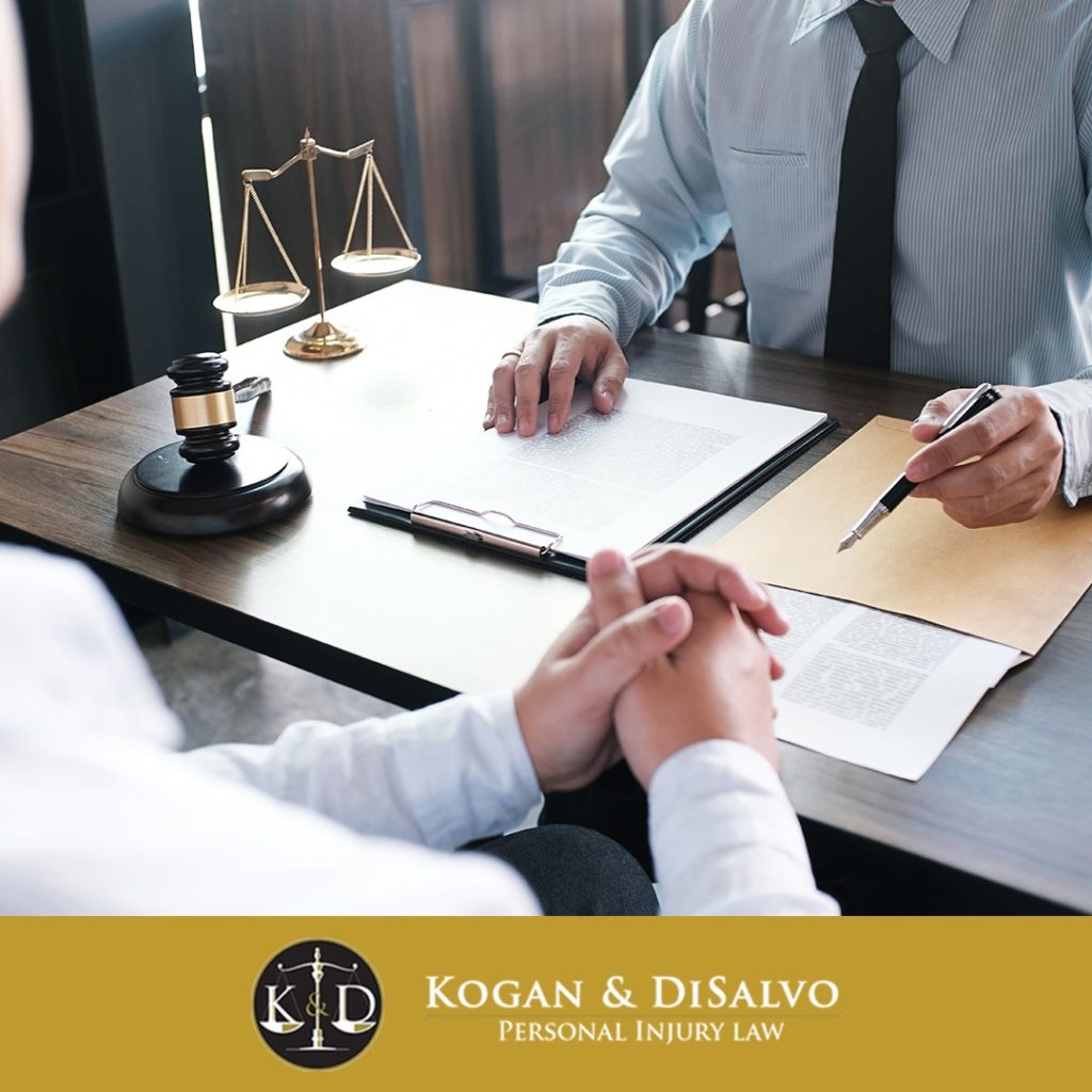 attorney with client discussing compensation for car accident