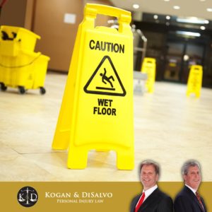 caution wet floor sign in store with attorney for florida slip and fall