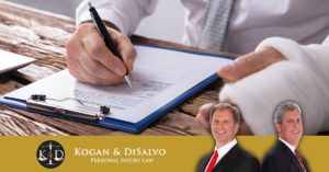 employee with injured hand filling out paperwork for workers compensation