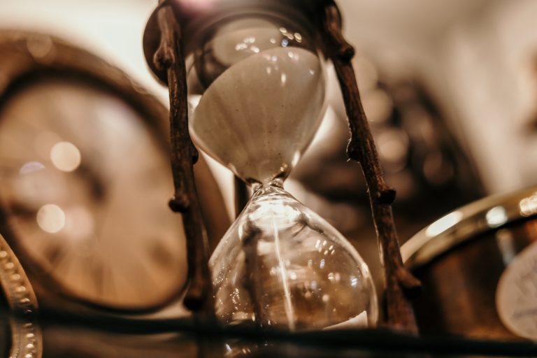 sand running through hourglass