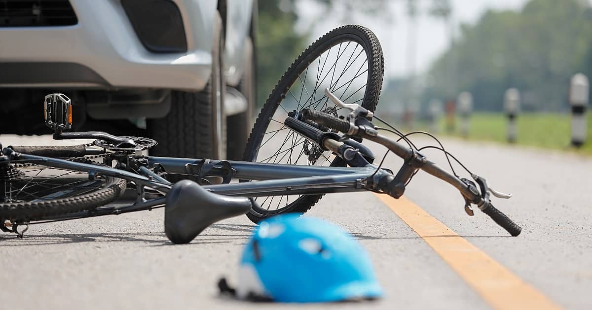Bicycle and helmet in the street after bike accident