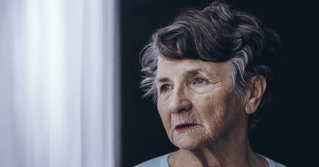 Close up of Older women in nursing home by window
