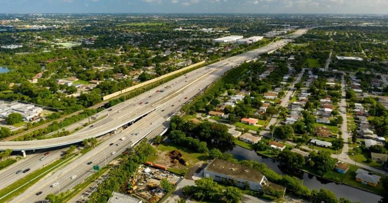 Helicopter view of city and highway