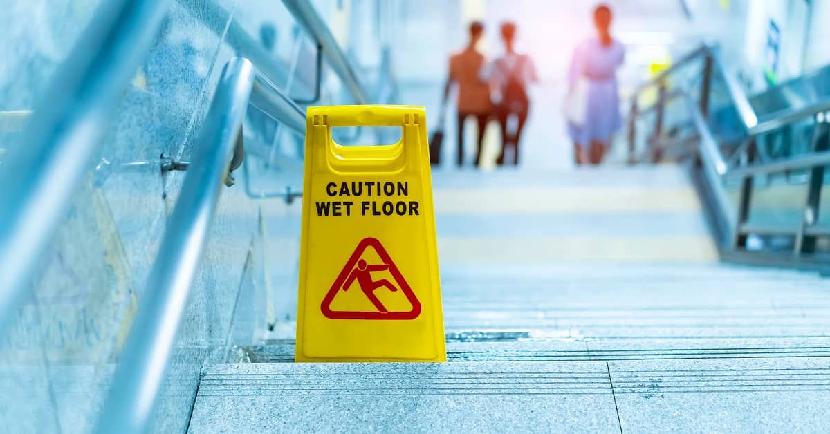 caution wet floor sign on the steps of a building