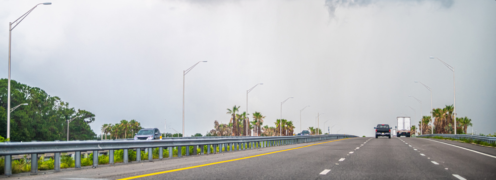 Cars driving on Interstate 95 on a cloudy day