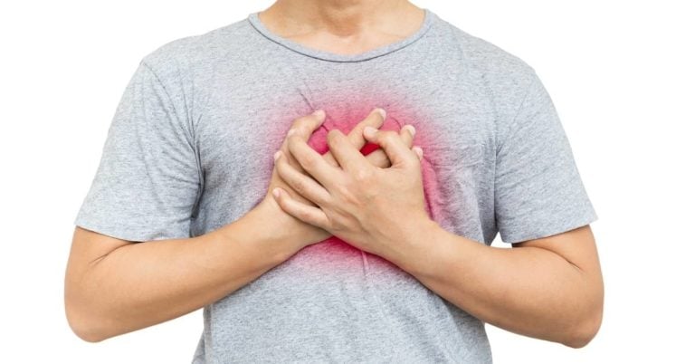 Man with grey shirt clinching chest