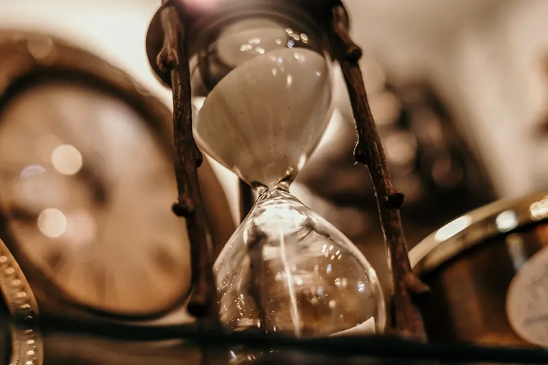 A shallow focus photograph of an hourglass