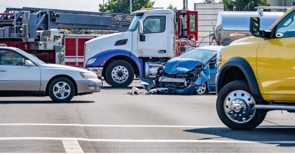 Car struck by Truck in auto accident at intersection