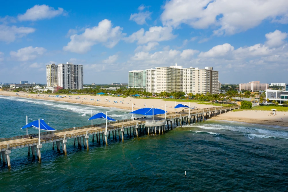 View of the beach and pier at Pompano Beach