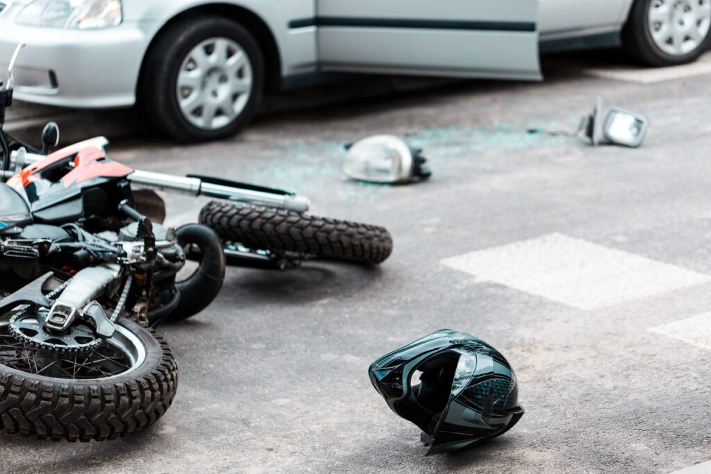 Overturned motorcycle in the street after an accident