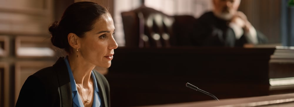 Woman testifying on the witness stand in court