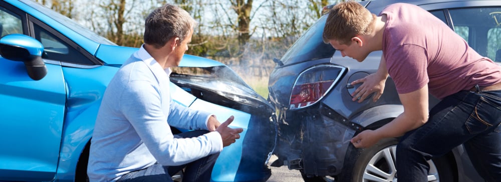 Two drivers arguing after a rear end collision car accident