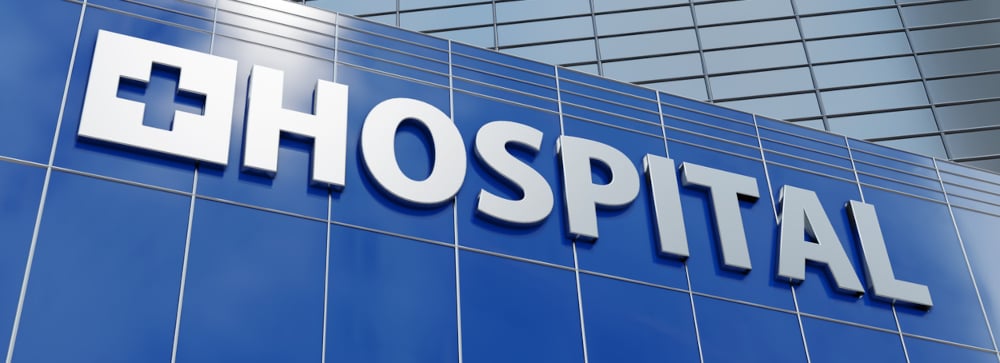 Exterior of a building with a sign reading "Hospital"
