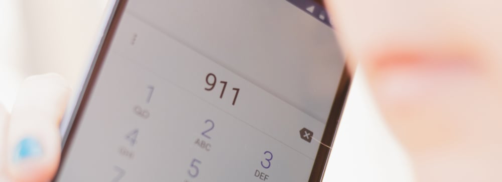 Closeup shot of phone display with the number 911 dialed