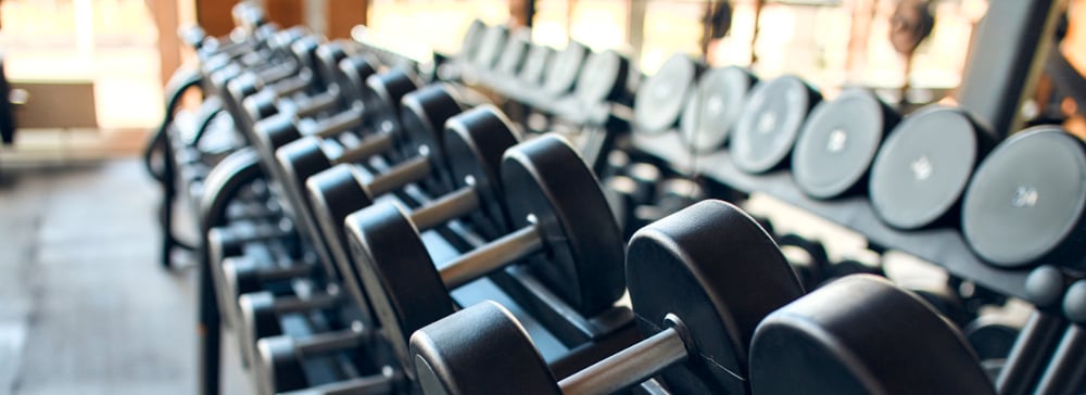 A weight rack in a commercial gym