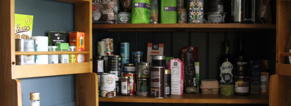 An open pantry filled with packaged foods