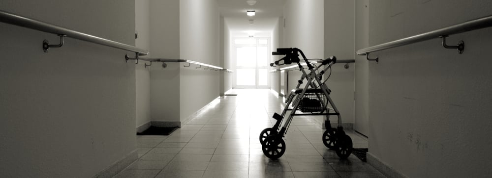 Dark corridor with walker in a nursing home