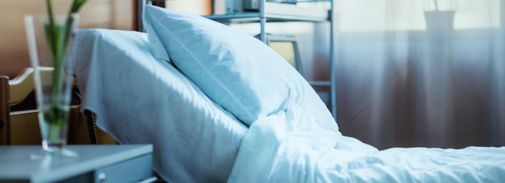 Side view of an empty hospital bed