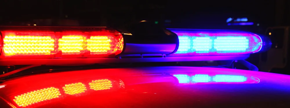 Vignette of police car lights at night